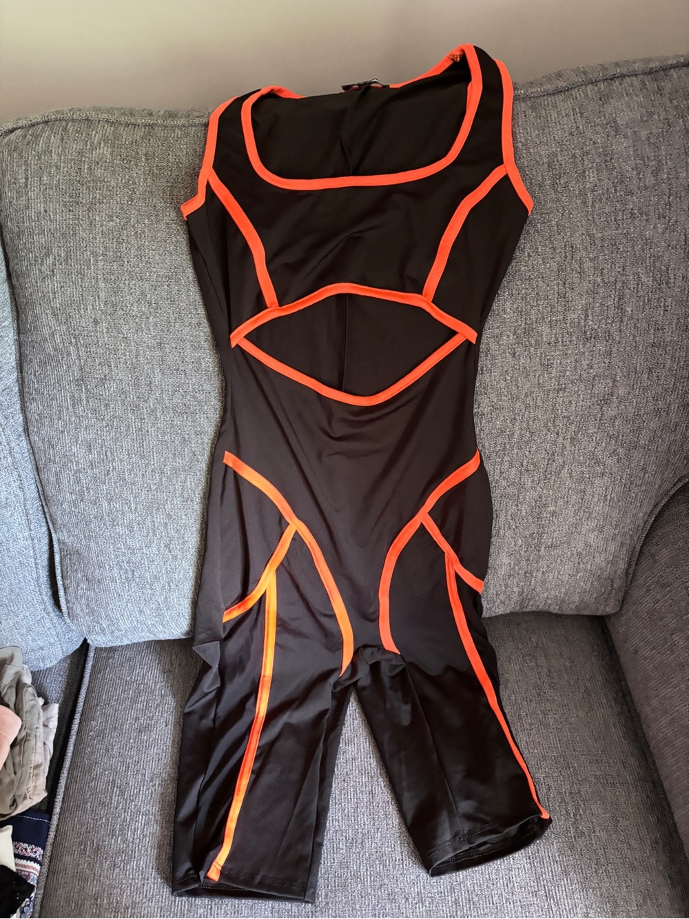 Black and Neon Orange Paneled One-Piece Athletic Suit